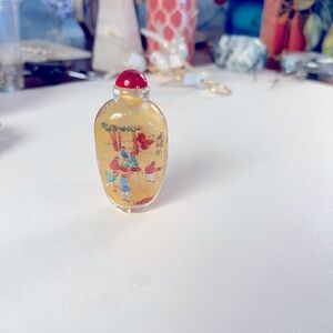 Antique Chinese glass snuff bottle with inside painted landscape scenes.